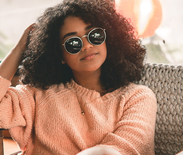 girl with sunglasses in chair